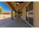 Large covered patio with ceiling fans and outdoor TV at 2111 N Piper Pl, Mesa, AZ 85215