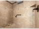 Tiled shower with a built-in bench, shower caddy, and grab bar at 2111 N Piper Pl, Mesa, AZ 85215