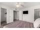A cozy bedroom with ceiling fan, and walk in closet at 2524 W Kiva Ave, Mesa, AZ 85202