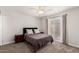 Comfortable bedroom with large window, ceiling fan, and carpet at 2524 W Kiva Ave, Mesa, AZ 85202