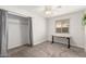 Bright bedroom featuring neutral carpet, a ceiling fan, and a window for natural light at 2524 W Kiva Ave, Mesa, AZ 85202