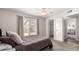 Relaxing bedroom with a ceiling fan, and sliding door leading to outdoor backyard at 2524 W Kiva Ave, Mesa, AZ 85202