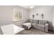 Well-lit bedroom with a pull-out couch and desk at 2524 W Kiva Ave, Mesa, AZ 85202