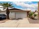 Exterior view of a one story home with a 2-car garage and desert landscaping at 2524 W Kiva Ave, Mesa, AZ 85202