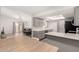 Eat in kitchen with gray cabinets, stainless steel appliances, and updated flooring at 2524 W Kiva Ave, Mesa, AZ 85202