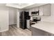 Updated kitchen featuring stainless steel appliances, neutral cabinets, and durable countertops at 2524 W Kiva Ave, Mesa, AZ 85202