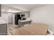 Kitchen with gray cabinets, stainless steel appliances, and breakfast bar seating at 2524 W Kiva Ave, Mesa, AZ 85202