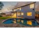 Enjoy your own backyard oasis with a pool and covered patio, perfect for relaxation at twilight at 2754 E Michelle Way, Gilbert, AZ 85234