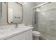This bathroom offers a framed mirror, marble counters, and glass-enclosed shower at 2754 E Michelle Way, Gilbert, AZ 85234