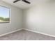 Cozy bedroom features neutral tones and large window at 2754 E Michelle Way, Gilbert, AZ 85234