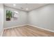 This bedroom features wood-look flooring and a large window at 2754 E Michelle Way, Gilbert, AZ 85234