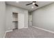This bedroom has neutral walls, plush carpeting, and a sliding door closet at 2754 E Michelle Way, Gilbert, AZ 85234