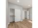 This bedroom has wood-look flooring, a sliding door closet, and natural light at 2754 E Michelle Way, Gilbert, AZ 85234