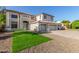 Attractive two-story home with a three-car garage and an artificial grass lawn at 2754 E Michelle Way, Gilbert, AZ 85234