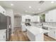 A well-appointed kitchen with stainless steel appliances, an island with quartz countertop, and white cabinets at 2754 E Michelle Way, Gilbert, AZ 85234