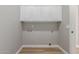 Bright laundry room with ample storage space and neutral walls at 2754 E Michelle Way, Gilbert, AZ 85234