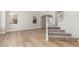Bright living room featuring hardwood floors, staircase, and large windows at 2754 E Michelle Way, Gilbert, AZ 85234