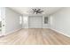 Bright living room featuring wood-look flooring, recessed lighting, and large windows that provide plenty of natural light at 2754 E Michelle Way, Gilbert, AZ 85234