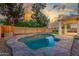Private backyard pool with stone surround, mature trees, and ample space for outdoor entertaining at 2754 E Michelle Way, Gilbert, AZ 85234