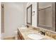 Bathroom featuring double sinks with granite countertop vanity and tile flooring at 3228 W Mercer Ln, Phoenix, AZ 85029