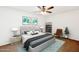 Stylishly decorated bedroom features a comfortable bed, wall art and modern furniture at 3228 W Mercer Ln, Phoenix, AZ 85029