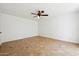 Simple, bright bedroom with neutral walls and tile flooring at 3228 W Mercer Ln, Phoenix, AZ 85029