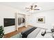 Comfortable bedroom with ceiling fan, tv and walk-in closet at 3228 W Mercer Ln, Phoenix, AZ 85029