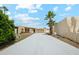 Desert home featuring a large driveway, desert landscaping, and a two-car garage at 3228 W Mercer Ln, Phoenix, AZ 85029