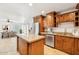 Open concept kitchen with stainless appliances, granite counters, and an island at 3228 W Mercer Ln, Phoenix, AZ 85029