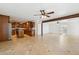 Open layout with wood cabinets, granite counters, and island with stainless appliances at 3228 W Mercer Ln, Phoenix, AZ 85029