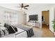 Light-filled bedroom with a ceiling fan, and a view into the walk-in closet at 3228 W Mercer Ln, Phoenix, AZ 85029