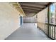 Covered patio with neutral siding, concrete floor, and partial shade screen at 3228 W Mercer Ln, Phoenix, AZ 85029