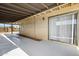Covered patio with siding, concrete floor, and sliding glass door at 3228 W Mercer Ln, Phoenix, AZ 85029