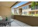 Relaxing balcony with table and chairs overlooking the complex and surrounding neighborhood at 3330 S Gilbert Rd # 1020, Chandler, AZ 85286