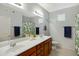 Bathroom with double sinks, cabinet storage and enclosed shower at 3330 S Gilbert Rd # 1020, Chandler, AZ 85286