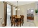 Inviting dining area with tile flooring, natural light, and view into bedroom at 3330 S Gilbert Rd # 1020, Chandler, AZ 85286