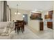 Open concept dining area featuring tile floors, dining table, and view into bedroom at 3330 S Gilbert Rd # 1020, Chandler, AZ 85286