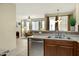 Well-lit kitchen with stainless steel dishwasher and spacious living area at 3330 S Gilbert Rd # 1020, Chandler, AZ 85286
