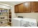Spacious laundry area with washer, dryer and cabinet storage above at 3330 S Gilbert Rd # 1020, Chandler, AZ 85286