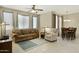 Spacious living room open to dining area with tile flooring and comfortable furniture at 3330 S Gilbert Rd # 1020, Chandler, AZ 85286