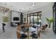 Comfortable resident lounge area with fireplace, TV, tables and ample seating at 3330 S Gilbert Rd # 1020, Chandler, AZ 85286