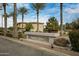 Beautiful community sign with lush landscaping and mature palm trees at 3330 S Gilbert Rd # 1020, Chandler, AZ 85286