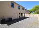 Wide shot of backyard featuring gravel, patio, and partial view of the home's exterior at 3330 W Gran Paradiso Dr, Phoenix, AZ 85086
