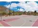 Community basketball court surrounded by desert landscape, mountains and clear blue skies at 3330 W Gran Paradiso Dr, Phoenix, AZ 85086