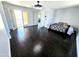 Spacious bedroom with a tray, dark hardwood floors, and natural light through french doors at 3330 W Gran Paradiso Dr, Phoenix, AZ 85086