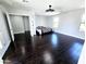 Bright bedroom featuring dark hardwood floors, white walls, and bright windows for natural light at 3330 W Gran Paradiso Dr, Phoenix, AZ 85086