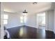 Bright, airy bedroom with dark hardwood floors, neutral walls, and plentiful natural light from large windows at 3330 W Gran Paradiso Dr, Phoenix, AZ 85086