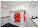 Spacious walk-in closet with ample storage and fashionable attire at 3330 W Gran Paradiso Dr, Phoenix, AZ 85086
