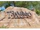 Entrance monument featuring the 'TRAMONTO' sign in metal set on large rocks at 3330 W Gran Paradiso Dr, Phoenix, AZ 85086