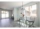 Modern dining area with stylish light fixture and lots of natural light at 3330 W Gran Paradiso Dr, Phoenix, AZ 85086